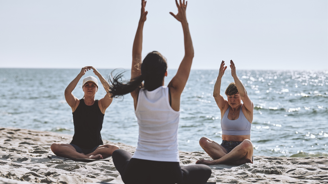 she academy beach yoga at mozambique retreat